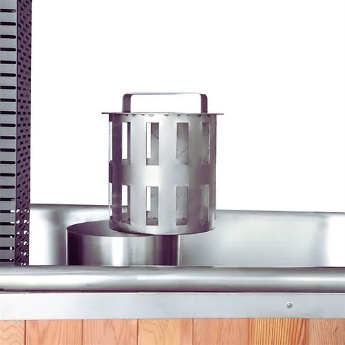 Handcrafted chimney flue attached to outdoor hot tub firebox