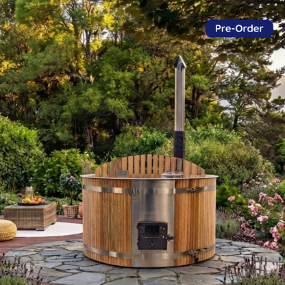 Large Cedar wood-fired hot tub with #304 stainless steel interior, insulated lid, and step ladder in a premium outdoor setting